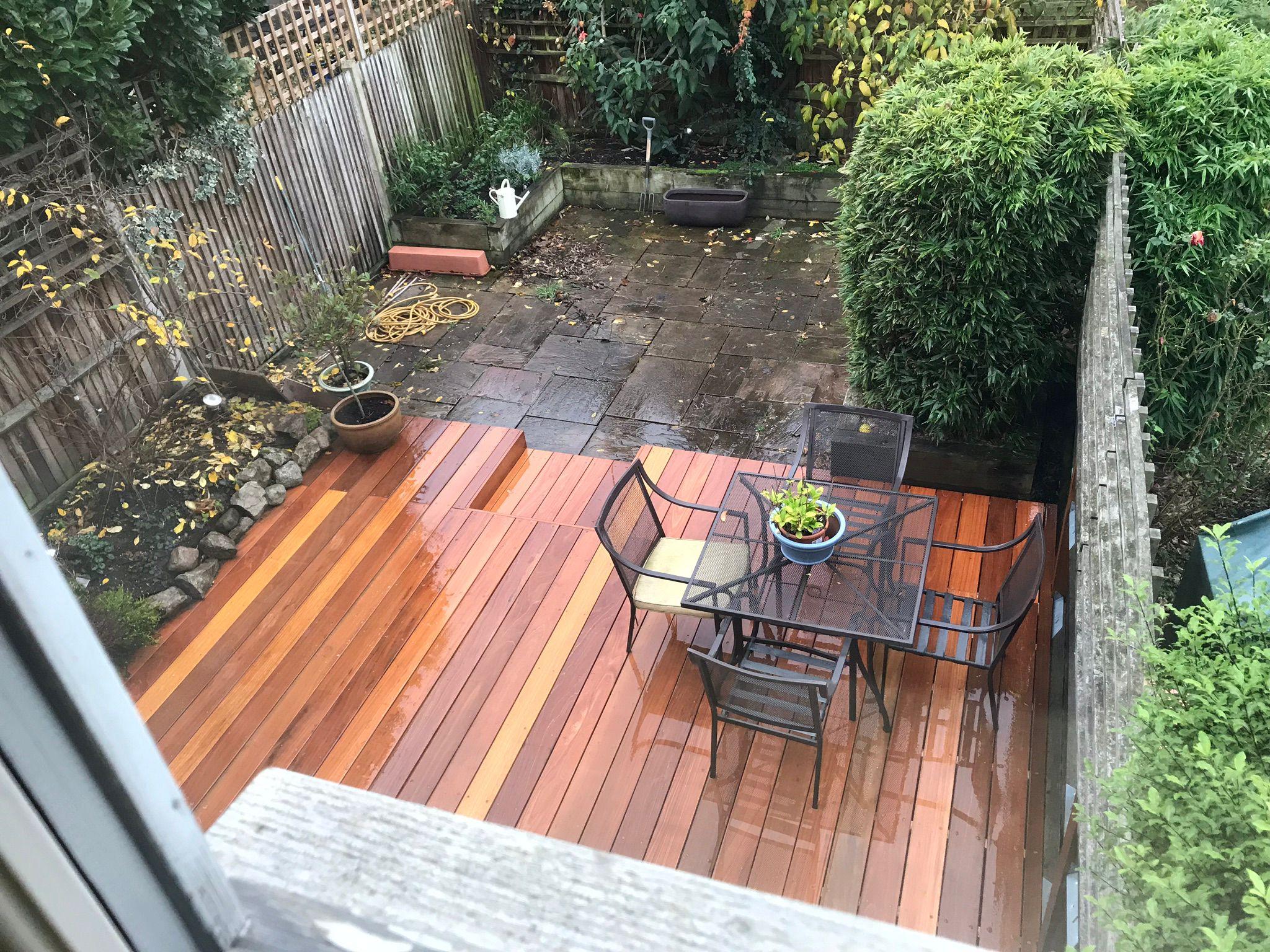 Aerial view of hardwood decking with garden paving, Surrey