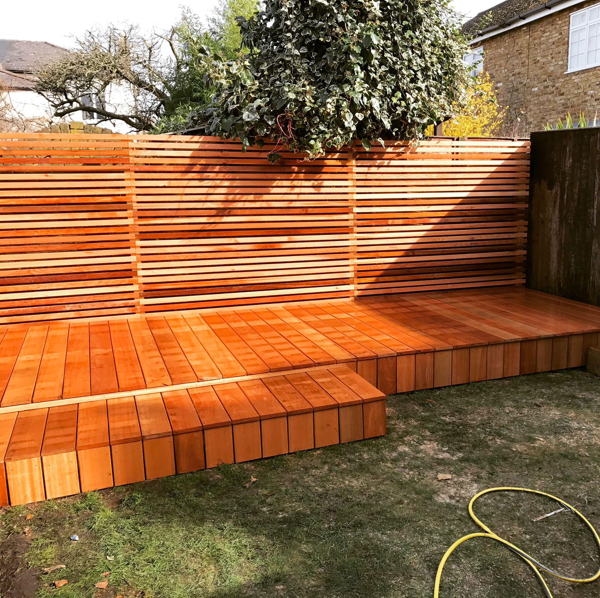 Hardwood decking steps with horizontal timber screen fence, Surrey