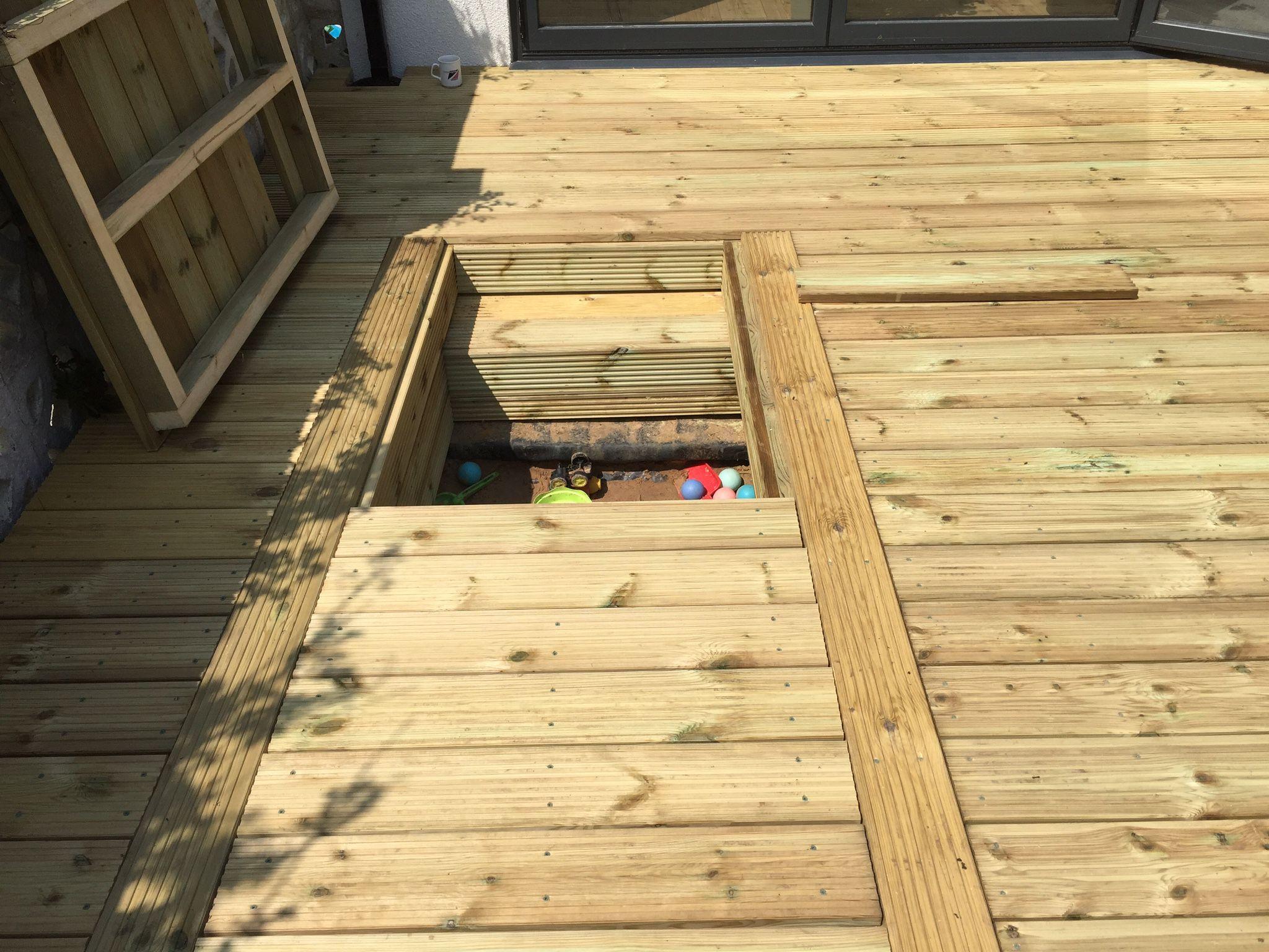 Timber decking with built-in storage bench, Surrey